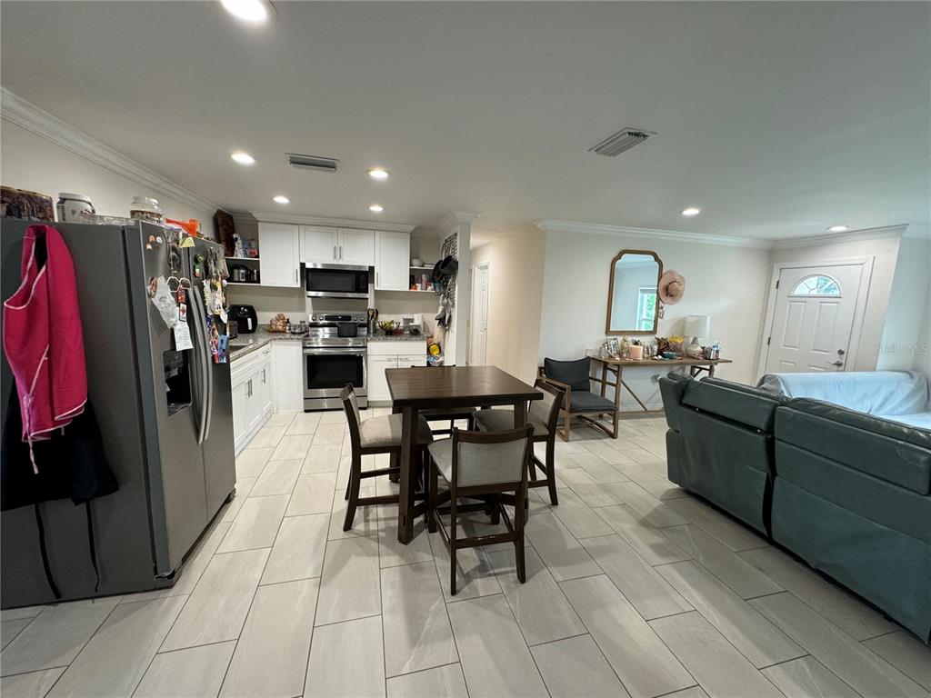 7102 Reindeer Road Tampa, FL 33619 - Photo 8 of 25 a view of a dining room with furniture