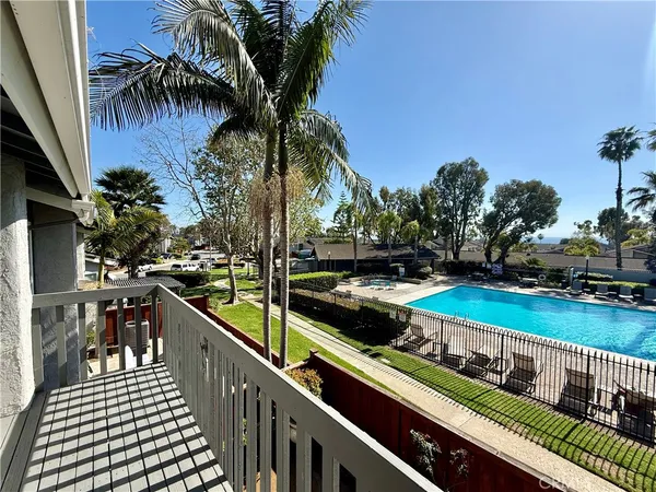 an aerial view of a house with a swimming pool