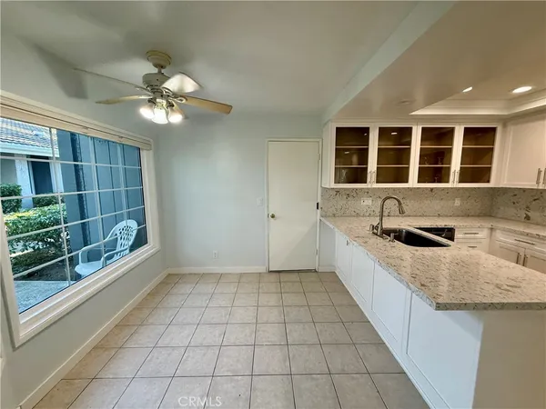 a large kitchen with a stove a sink and dishwasher