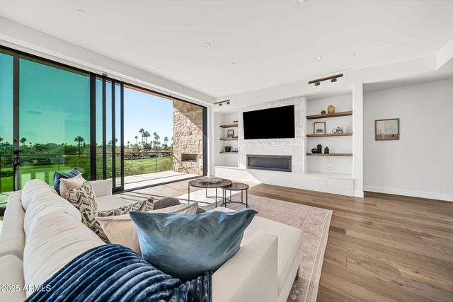 a spacious bedroom with a large bed and a large window