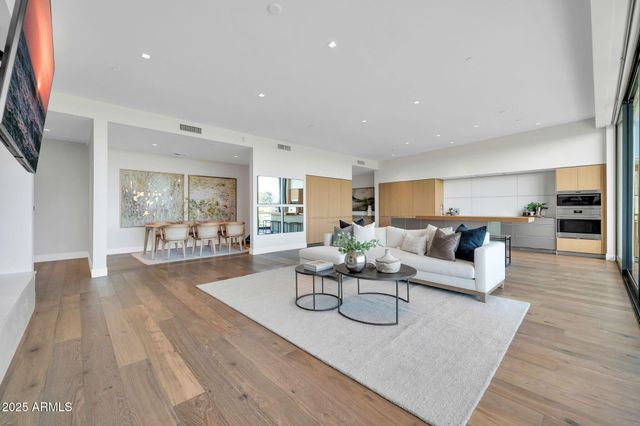 a bathroom with a double vanity sink mirror and bathtub