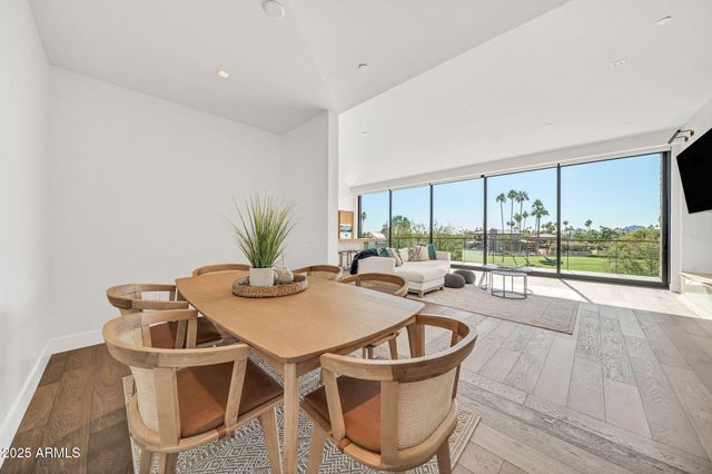a view of a bedroom with furniture and window