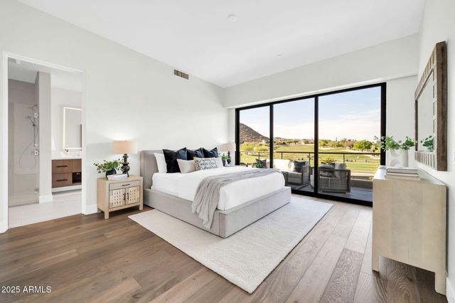 a view of a roof deck with couches and city view