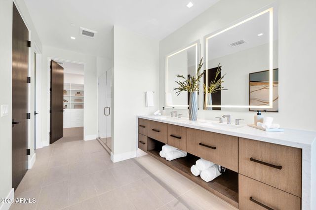 a bathroom with a sink and mirror