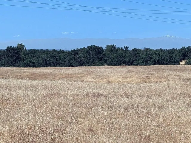 a view of an ocean beach and mountain