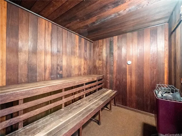 a view of a room with furniture and a bathtub