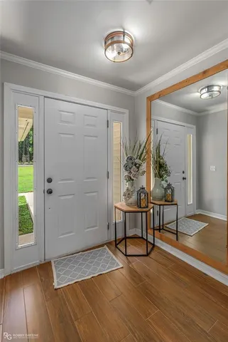 a view of a livingroom with furniture and a window