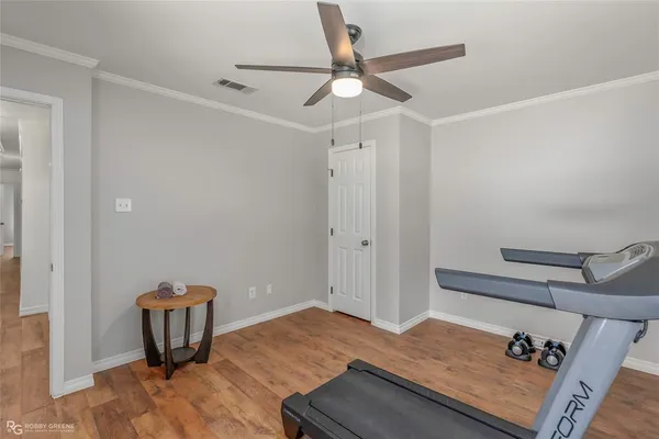 a view of a hardwood floor and wardrobe