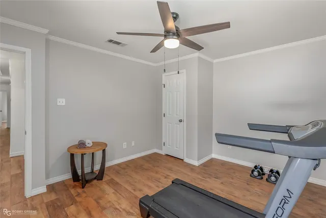 a view of a hardwood floor and wardrobe