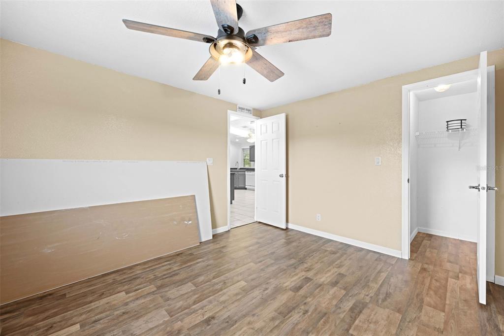 33320 Larkin Road Dade City, FL 33523 - Photo 42 of 60 wooden floor in an empty room with a window