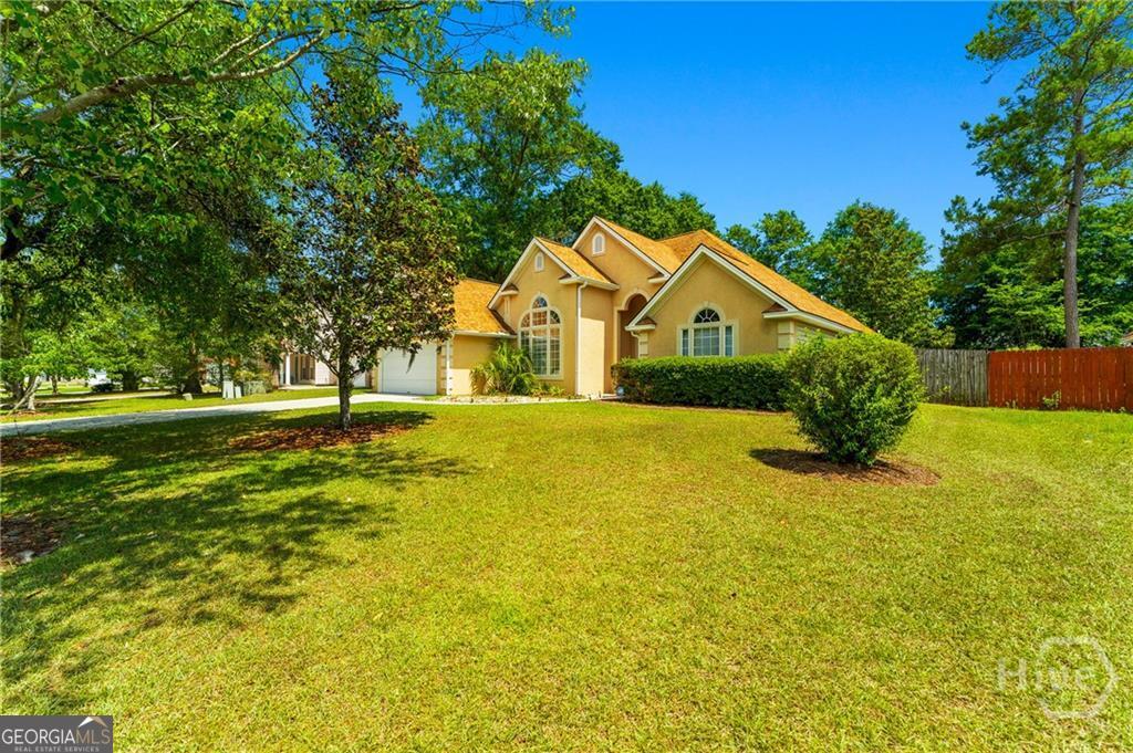 10 Fox Hound Court Pooler, GA 31322 - Photo 4 of 32 a front view of a house with a yard