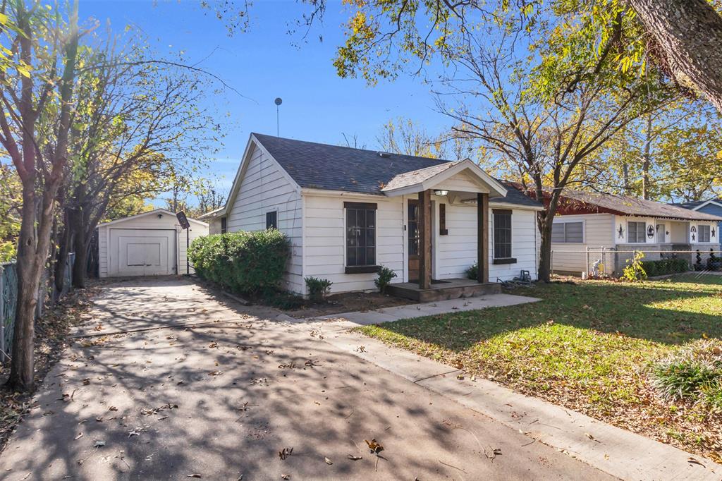 603 Lilly Street Cleburne, TX 76033 - Photo 2 of 30 View of front of house with front lawn and detached garage