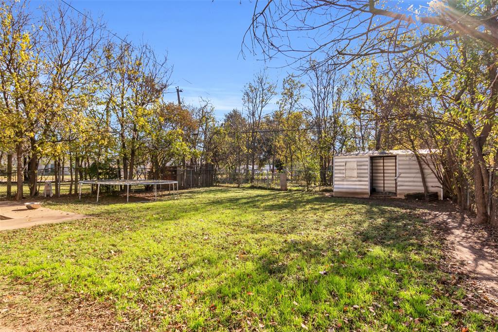 603 Lilly Street Cleburne, TX 76033 - Photo 22 of 30 View of yard with a shed
