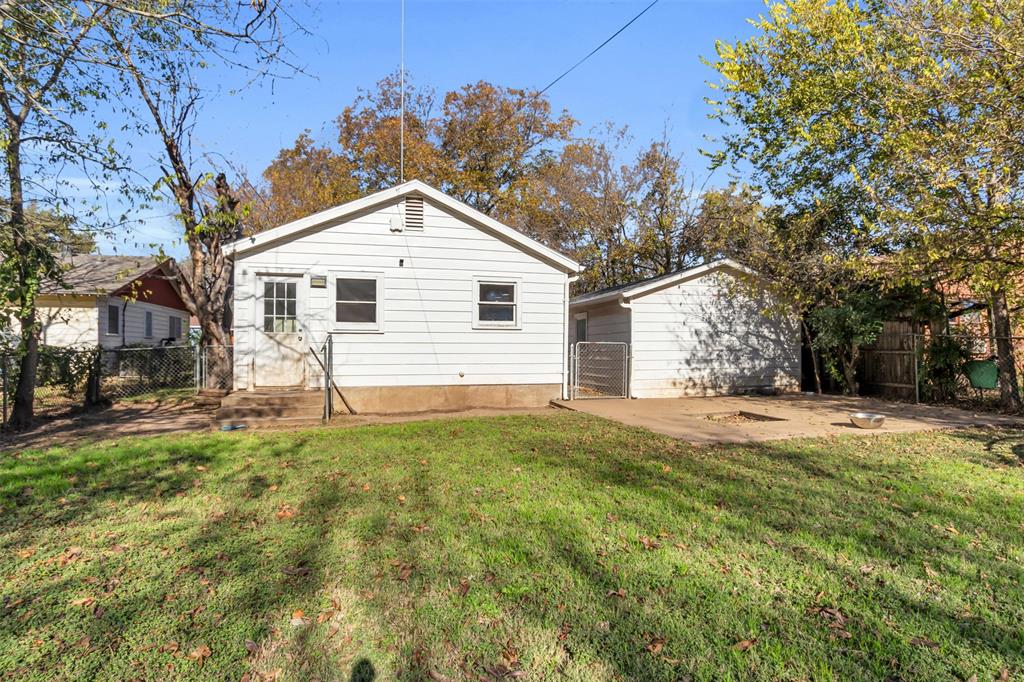 603 Lilly Street Cleburne, TX 76033 - Photo 23 of 30 Back of house with a lawn and a patio area