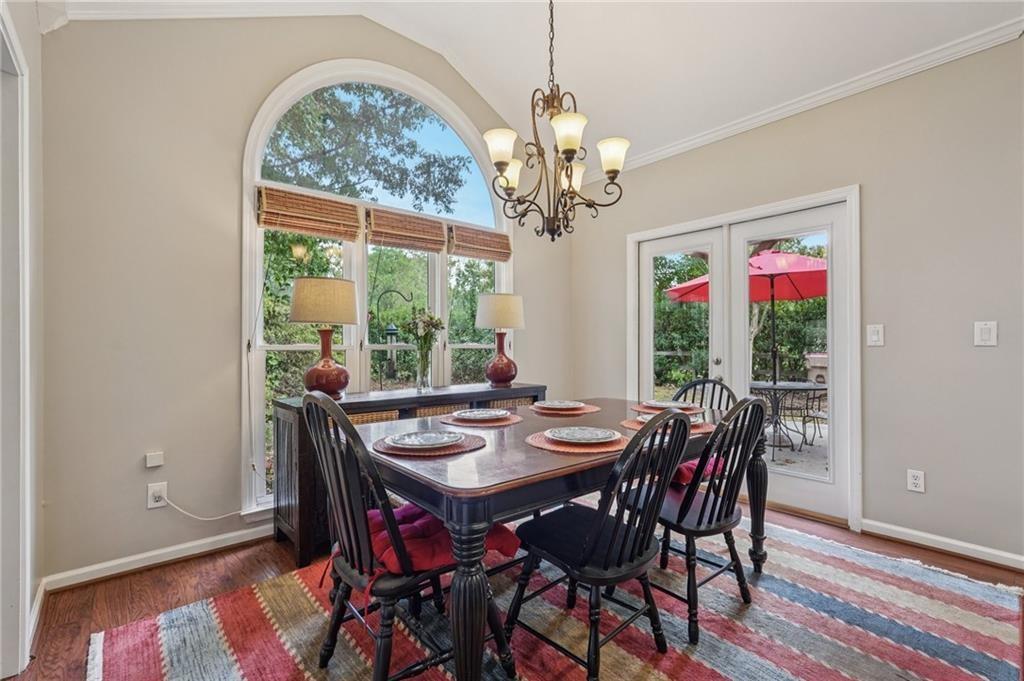 3820 Ridge Point Drive Suwanee, GA 30024 - Photo 15 of 41 a view of a dining room with furniture window and wooden floor
