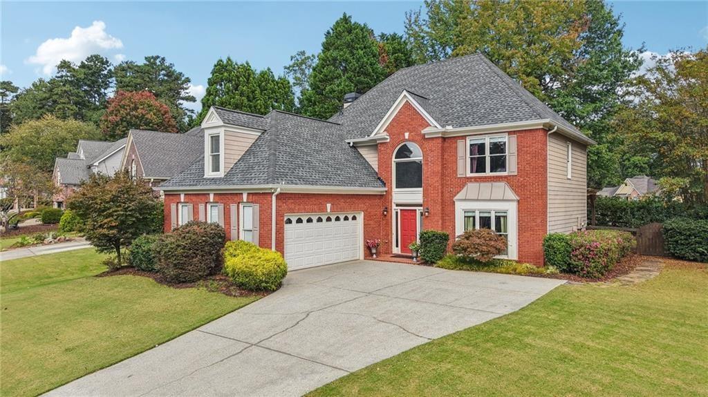 3820 Ridge Point Drive Suwanee, GA 30024 - Photo 2 of 41 a view of multiple houses with a yard