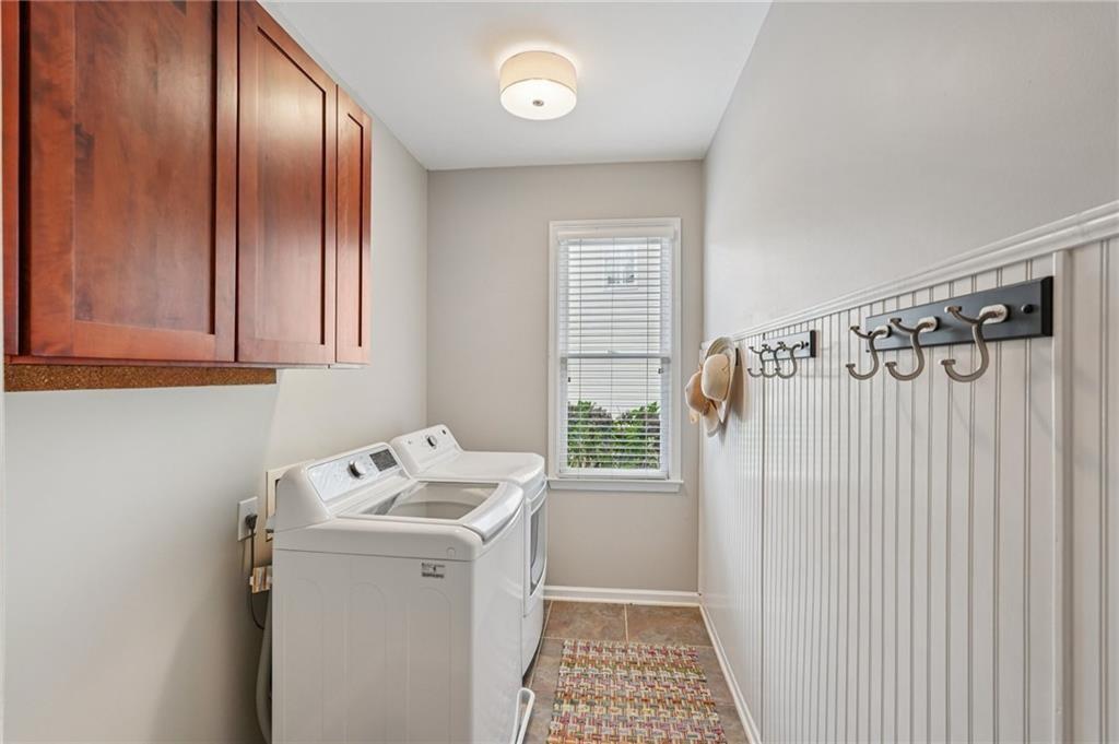 3820 Ridge Point Drive Suwanee, GA 30024 - Photo 22 of 41 a bathroom with a sink a toilet and shower
