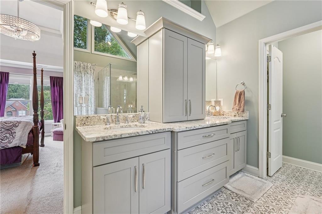 3820 Ridge Point Drive Suwanee, GA 30024 - Photo 30 of 41 a bathroom with a granite countertop sink and a mirror