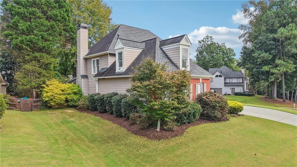 3820 Ridge Point Drive Suwanee, GA 30024 - Photo 3 of 41 a view of a house with a backyard