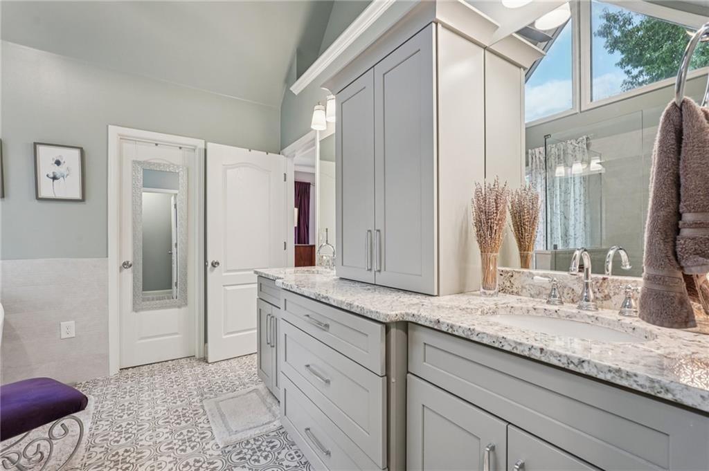 3820 Ridge Point Drive Suwanee, GA 30024 - Photo 31 of 41 a bathroom with a granite countertop sink and a mirror