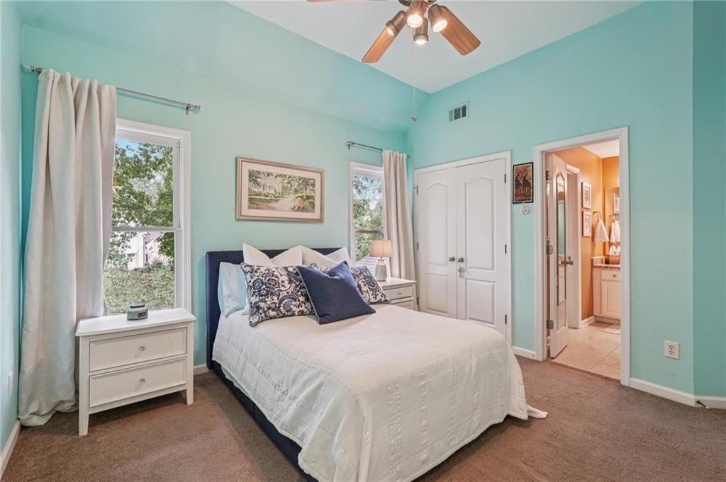 3820 Ridge Point Drive Suwanee, GA 30024 - Photo 36 of 41 a bedroom with a bed and a window