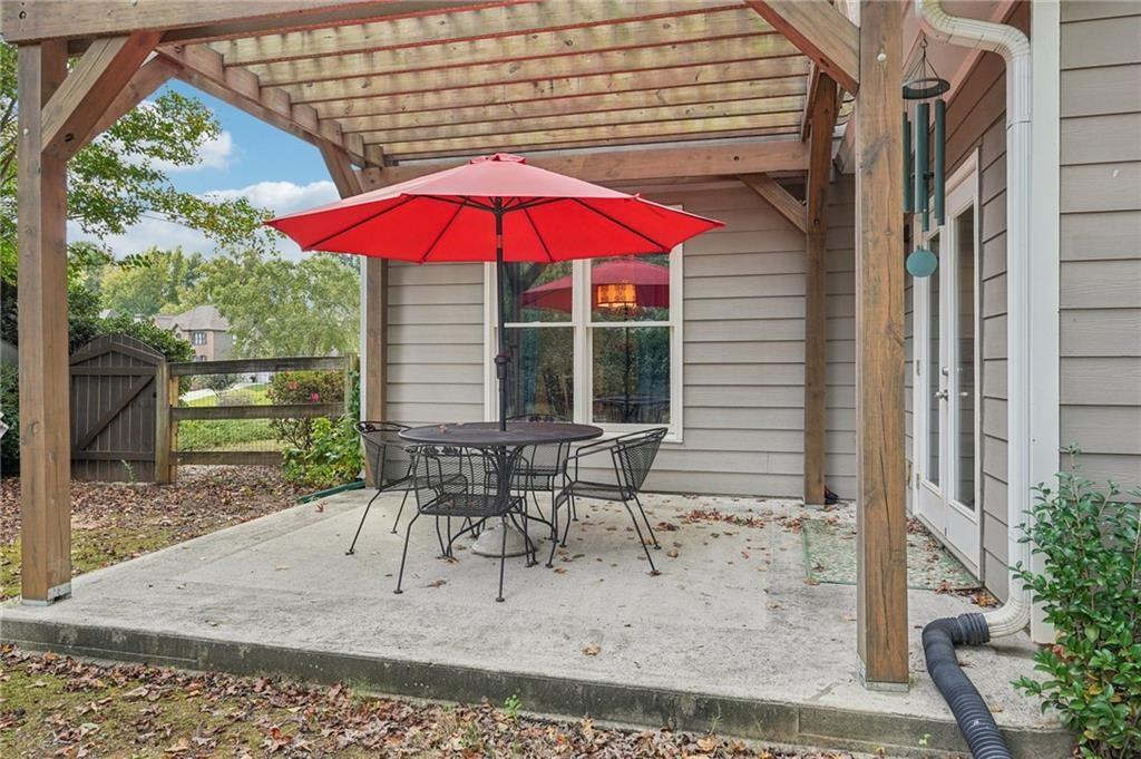 3820 Ridge Point Drive Suwanee, GA 30024 - Photo 39 of 41 a view of a house with backyard and sitting area