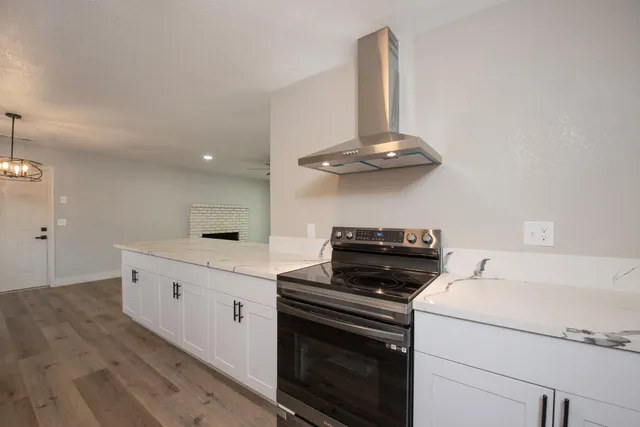 a kitchen with a stove and a microwave