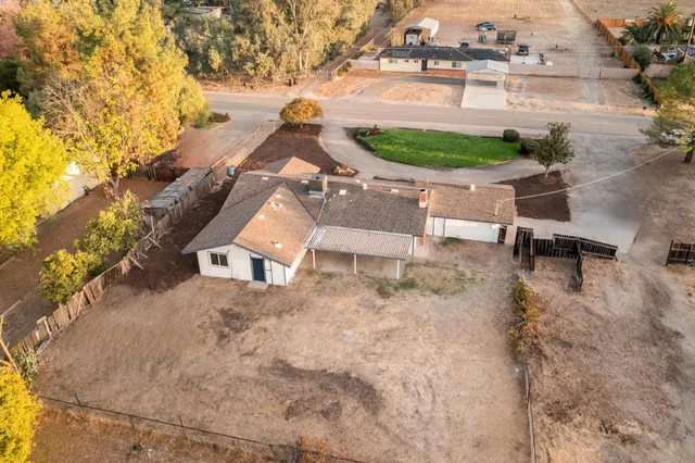 a kitchen with granite countertop a refrigerator and a stove