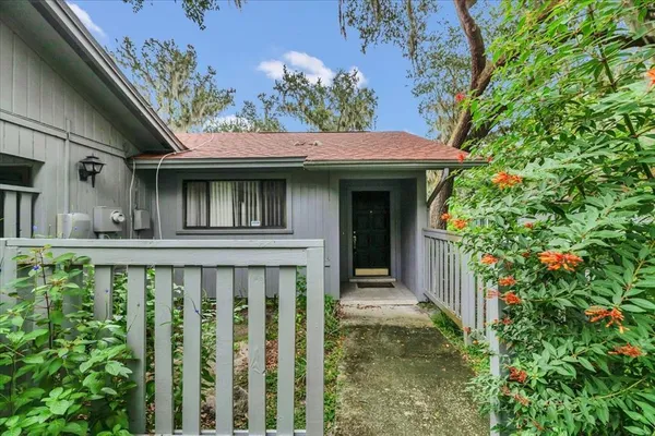 a view of a house with a small yard