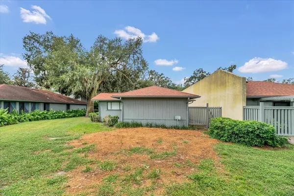 a view of a yard with a tree