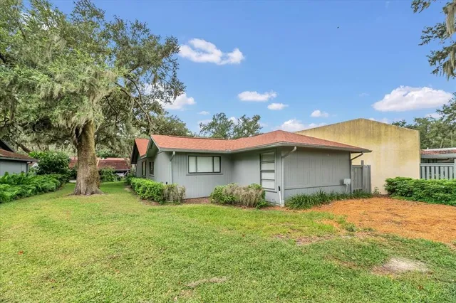 a backyard of a house with lots of green space