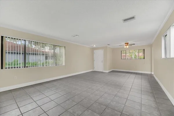 a view of an empty room with a window