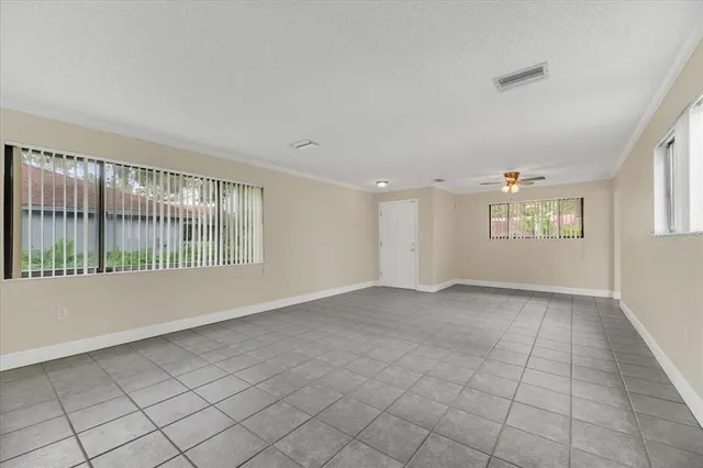 a view of an empty room with a window