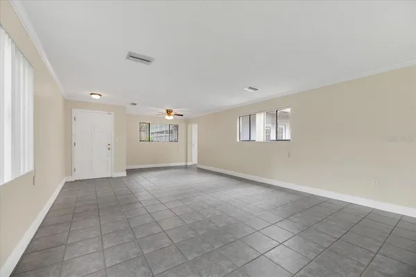 a view of an empty room with a window