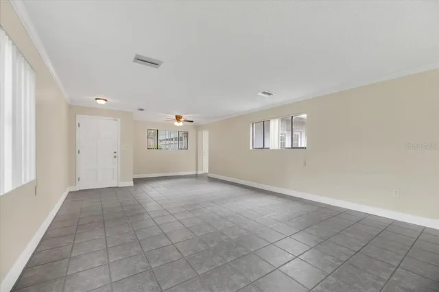 a view of an empty room with a window