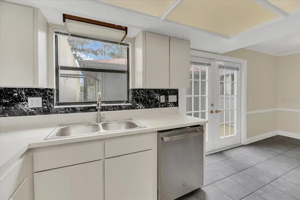 a kitchen with a sink and cabinets
