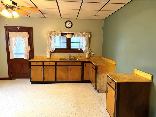 a kitchen with stainless steel appliances granite countertop a stove a sink and dishwasher