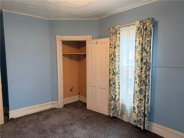 an empty room with windows and mountain view