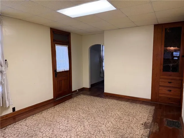 a view of an empty room and cabinet