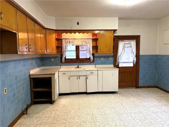 a kitchen with a sink and cabinets