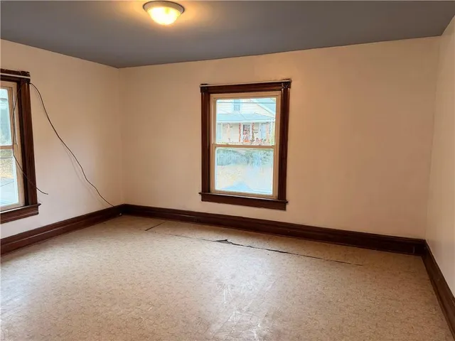 an empty room with windows