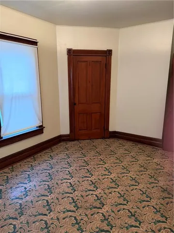 a bathroom with a tub a sink and mirror