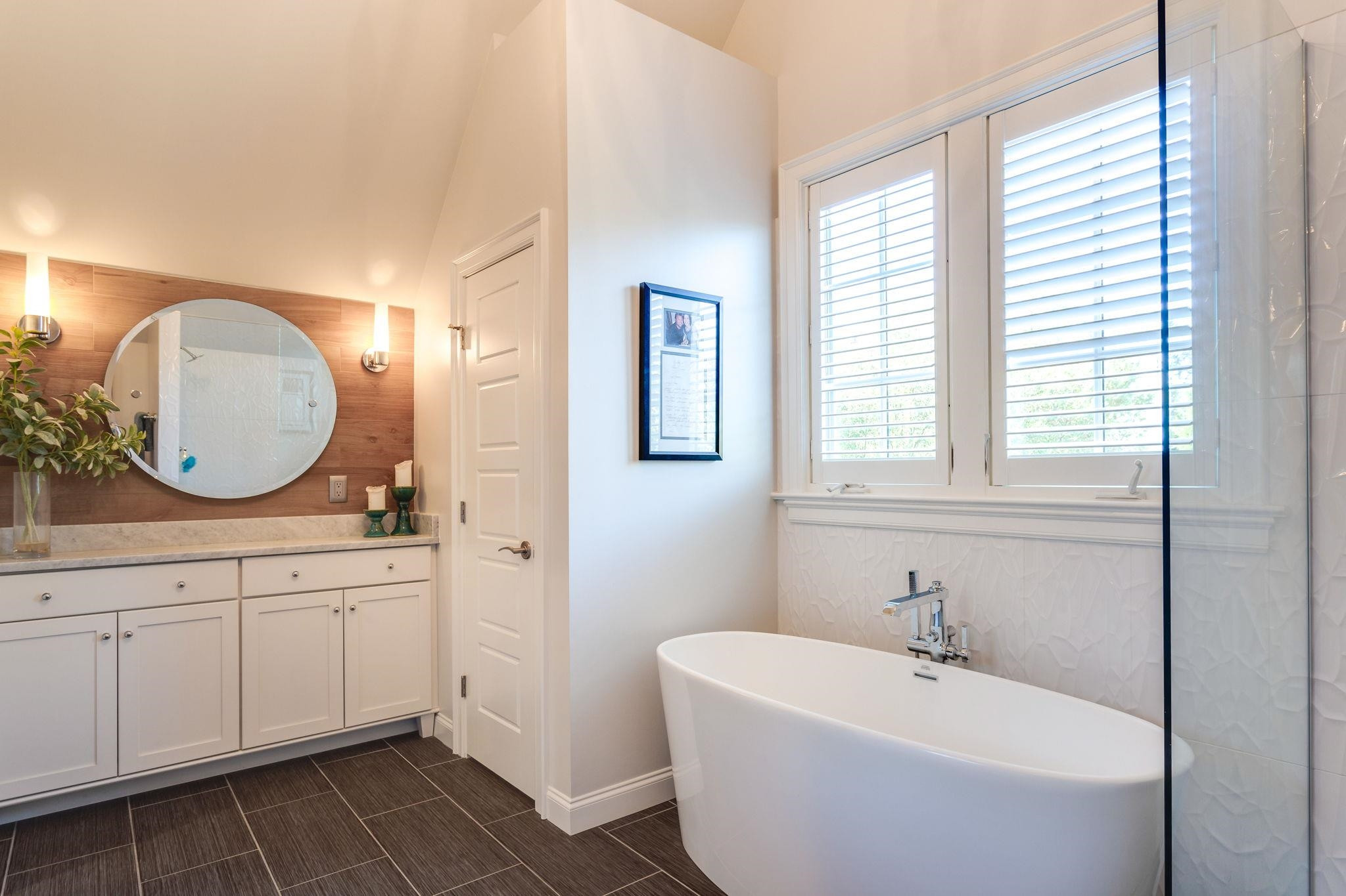 2008 Vinnings Place Raleigh, NC 27608 - Photo 31 of 55 a spacious bathroom with a tub a sink and a mirror