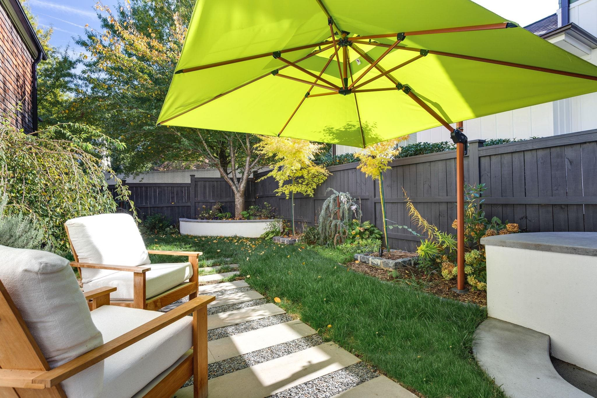 2008 Vinnings Place Raleigh, NC 27608 - Photo 44 of 55 a view of an outdoor sitting area with furniture and umbrella