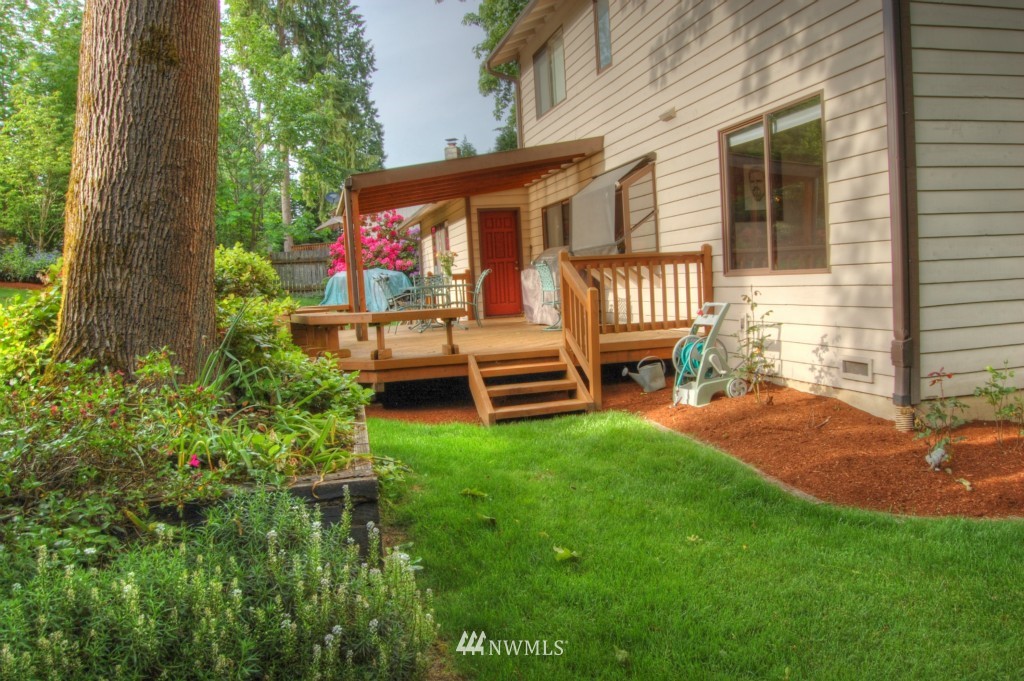 18731 129th Court Northeast Bothell, WA 98011 - Photo 2 of 24 a backyard of a house with seating space