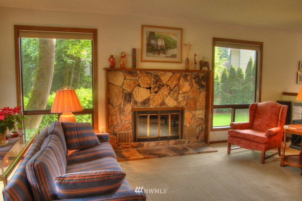 18731 129th Court Northeast Bothell, WA 98011 - Photo 13 of 24 a living room with furniture and a fireplace