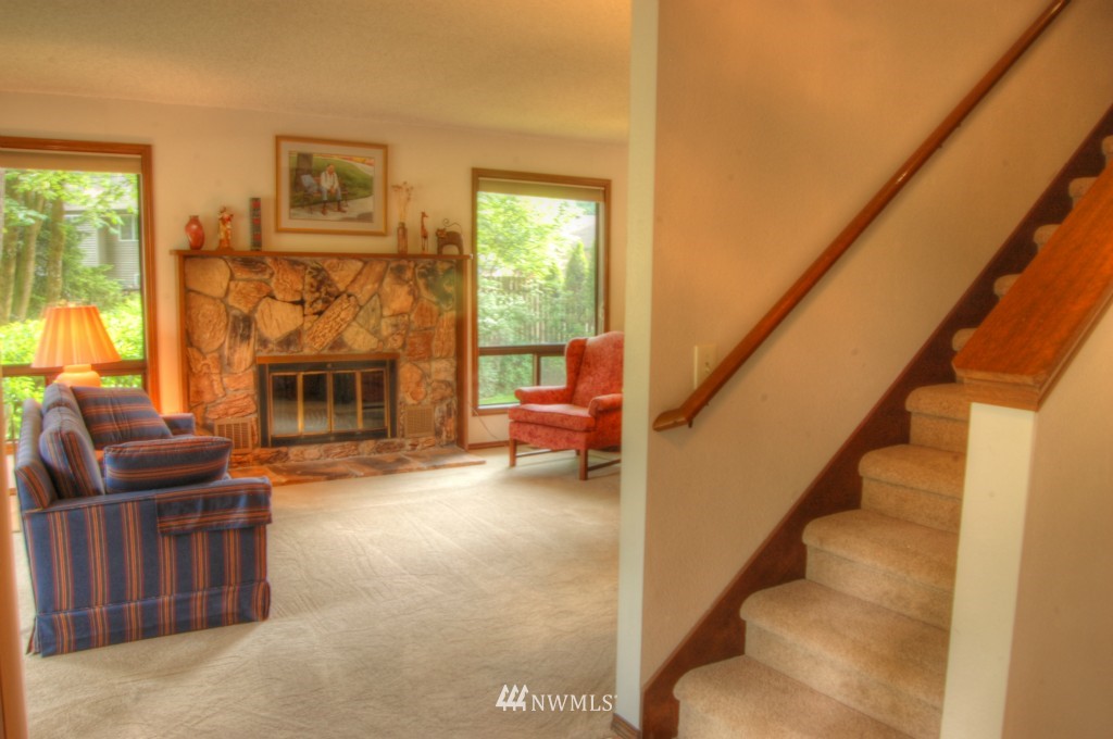 18731 129th Court Northeast Bothell, WA 98011 - Photo 16 of 24 a living room with furniture and a fireplace