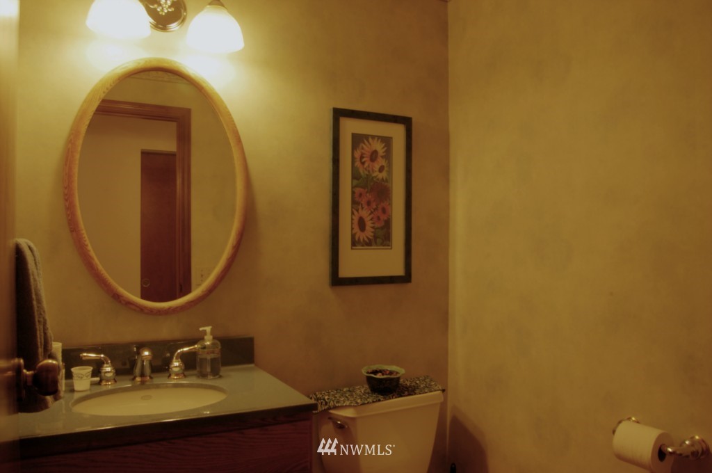 18731 129th Court Northeast Bothell, WA 98011 - Photo 18 of 24 a bathroom with a sink and a mirror