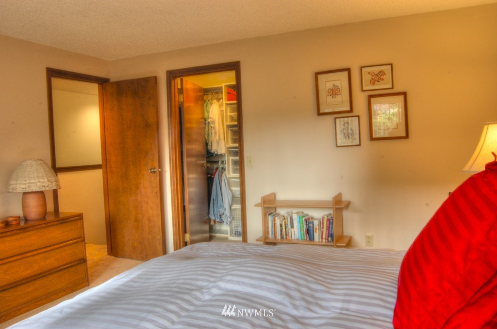18731 129th Court Northeast Bothell, WA 98011 - Photo 20 of 24 a bedroom with a bed and a cabinet