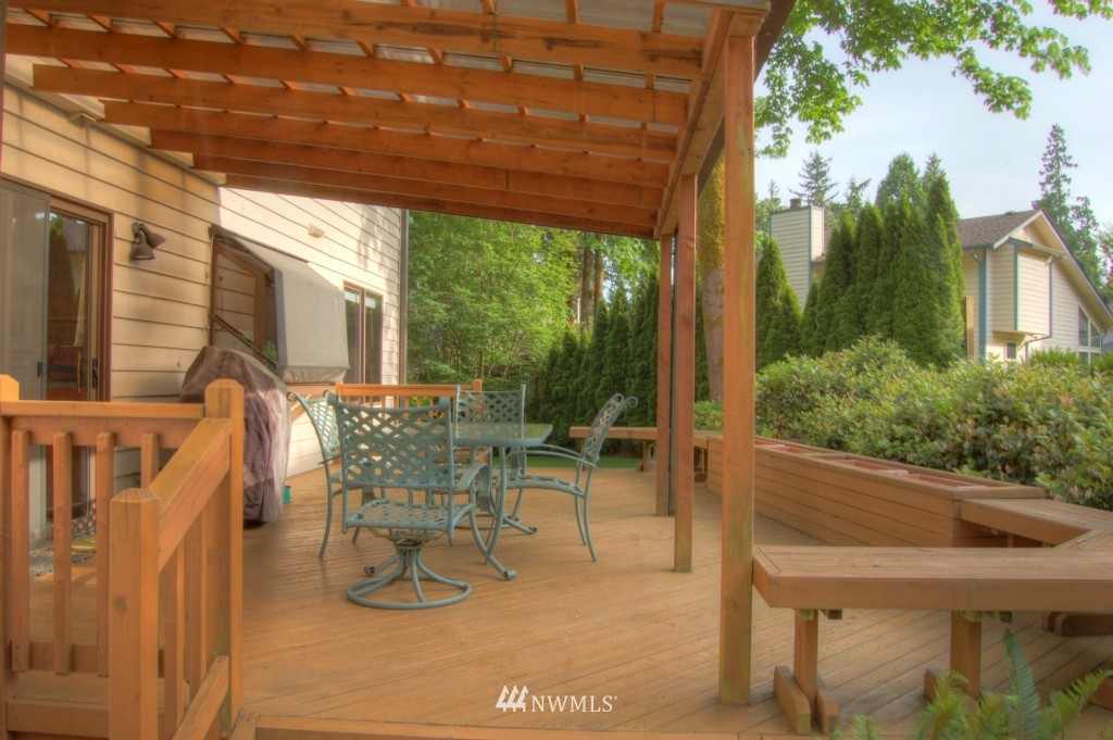 18731 129th Court Northeast Bothell, WA 98011 - Photo 4 of 24 a building outdoor space with patio furniture and potted plants